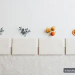 Four neat blank envelopes in a row suggesting quarterly rhythm, in soft daylight.